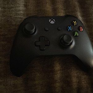 Black Xbox controller, used.